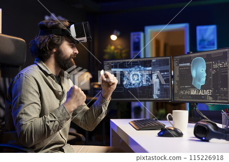 Computer engineer using VR headset, celebrating after awakening sentient AI asking existential questions. Cheerful programmer using virtual reality technology to interact with artificial intelligence Computer engineer using VR headset, celebrating after awakening sentient AI asking existential questions. Cheerful programmer using virtual reality technology to interact with artificial intelligence 115226918