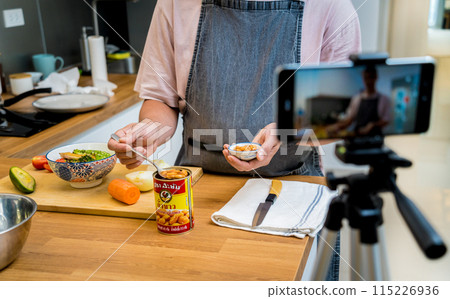 The chef is broadcasting live from workshop how to prepare a vegetarian food The chef is broadcasting live from workshop how to prepare a vegetarian food 115226936