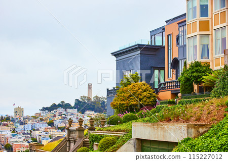 Close together housing with distant view of city below Telegraph Hill with Coit Tower 115227012