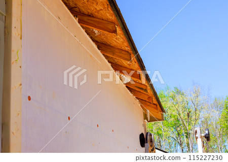 As part of remodeling process, master makes repairs to fascia trim that was damaged 115227230