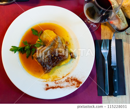 Baked boneless pork meat in gravy with stewed potatoes Baked boneless pork meat in gravy with stewed potatoes 115228031