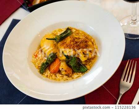 Dish of chicken thigh curry with rice and padron pepper Dish of chicken thigh curry with rice and padron pepper 115228136