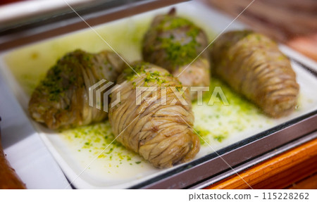 Uncooked madejas aragones on counter in cafe Uncooked madejas aragones on counter in cafe 115228262