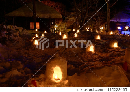 Illuminated mini igloos and old houses at Heike no Sato in Yunishigawa Onsen in winter 115228465