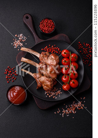 Delicious juicy meat on the bone or rack of lamb or grilled veal 115228896