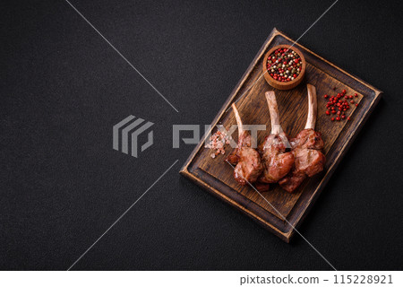 Delicious juicy meat on the bone or rack of lamb or grilled veal Delicious juicy meat on the bone or rack of lamb or grilled veal 115228921