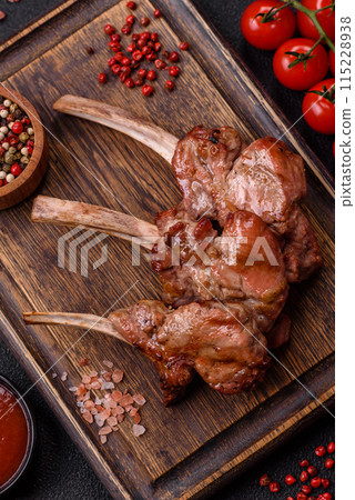 Delicious juicy meat on the bone or rack of lamb or grilled veal 115228938