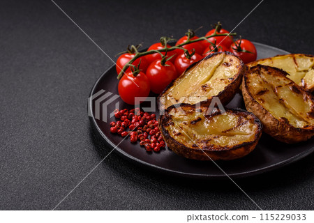 Delicious potato halves in skins baked on the grill 115229033