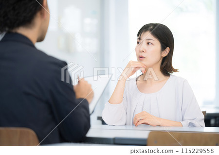 Image of parent-teacher conference with school or cram school. Parents worried about their children's grades. Image of career choices and cram school consultation. Image of parent-teacher conference with school or cram school. Parents worried about their children's grades. Image of career choices and cram school consultation. 115229558