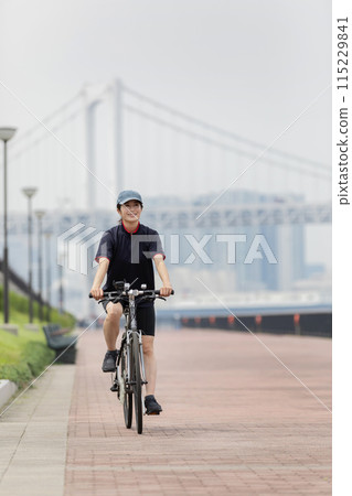 cycling woman bicycle 115229841