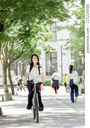 Commuting woman bicycle Commuting woman bicycle 115229888
