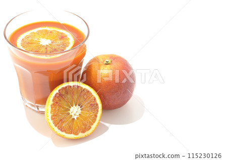 Blood orange juice photographed on a white background Blood orange juice photographed on a white background 115230126