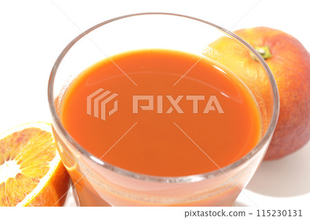 Blood orange juice photographed on a white background Blood orange juice photographed on a white background 115230131