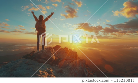 Silhouette of a Person Standing on a Clifftop at Sunset 115230815
