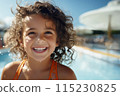 cute little girl in the pool at the aquapark on resort 115230825