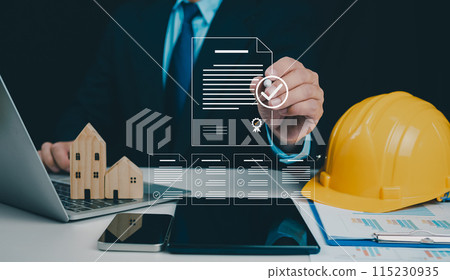 Architect or engineer Checking the list of documents and approving the project, Approved Buildings Permit concept with approved residential building project, Construction project inspection. 115230935