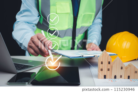 Architect or engineer Checking the list of documents and approving the project, Approved Buildings Permit concept with approved residential building project, Construction project inspection. 115230946