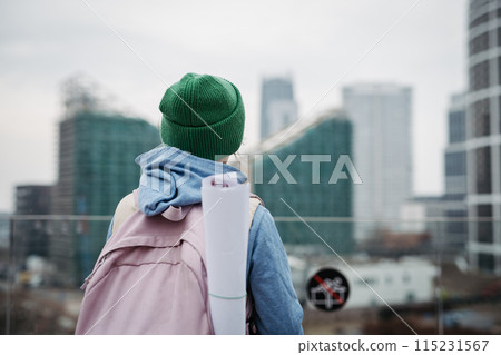 Sad girl alone in city, waiting for parents. Young schoolgirl with no friends, feeling lonely. Sad girl alone in city, waiting for parents. Young schoolgirl with no friends, feeling lonely. 115231567