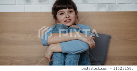 Portrait of cute young girl. Girl with long hair sitting at home. Banner with copy space. Portrait of cute young girl. Girl with long hair sitting at home. Banner with copy space. 115231593