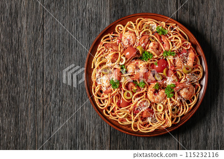 shrimp fra diavolo with spaghetti on a plate 115232116