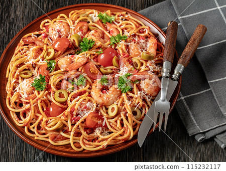 shrimp fra diavolo with spaghetti on a plate 115232117