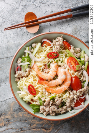 Yum Mama Thai Instant Noodle Salad closeup on the plate. Vertical top view 115232305