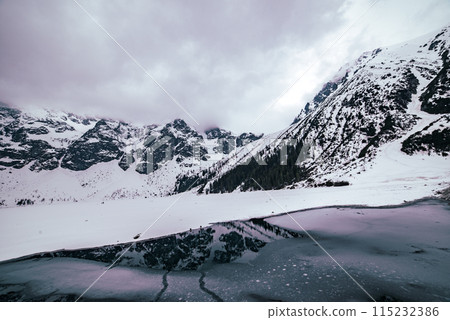 Frozen Lake Morskie Oko or Sea Eye Lake in Poland at Winter. Frozen Lake Morskie Oko or Sea Eye Lake in Poland at Winter. 115232386