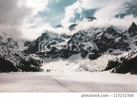 Frozen Lake Morskie Oko or Sea Eye Lake in Poland at Winter. Frozen Lake Morskie Oko or Sea Eye Lake in Poland at Winter. 115232388