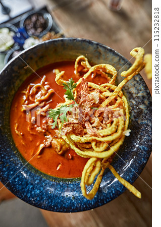 Spicy curry noodles soup with chicken (Khao Soi) Spicy curry noodles soup with chicken (Khao Soi) 115232818