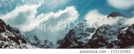 Mountain peaks near Morskie Oko or Sea Eye Lake in Poland at Winter. Tatras range Mountain peaks near Morskie Oko or Sea Eye Lake in Poland at Winter. Tatras range 115232892