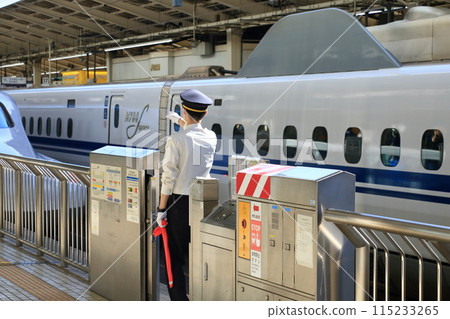 Station staff seeing off the Shinkansen Station staff seeing off the Shinkansen 115233265