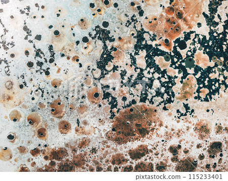 Grunge texture of an old burned metal sheet plate 115233401