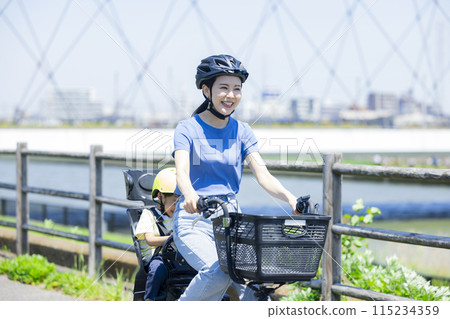 Parents riding a bicycle 115234359