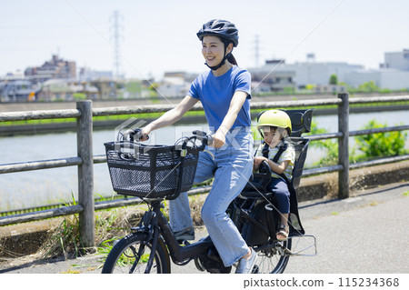 Parents riding a bicycle 115234368