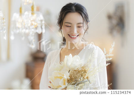 Young woman in a wedding dress 115234374