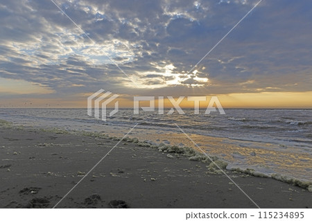 Panoramic picture over the beach of Ouddorp in Holland in the evening during sunset Panoramic picture over the beach of Ouddorp in Holland in the evening during sunset 115234895