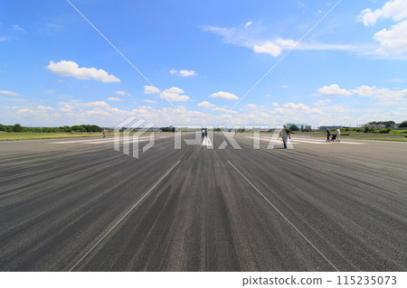 Runway Walk: A long runway and a blue summer sky Runway Walk: A long runway and a blue summer sky 115235073
