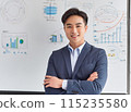 A Japanese man giving a lecture using graphs 115235580