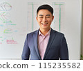 Young businessman standing in front of a whiteboard 115235582