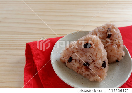 Red rice balls on the table background 115236573