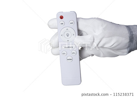 Picture of a white remote control in hand Picture of a white remote control in hand 115238371