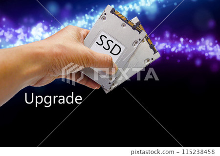 SSD hard drive, hand holding SSD 115238458