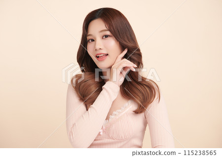 Beautiful young asian woman with clean fresh skin on beige background, Face care, Facial treatment, Cosmetology, beauty and spa, Asian women portrait. 115238565