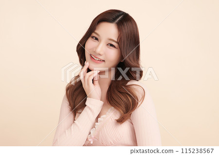 Beautiful young asian woman with clean fresh skin on beige background, Face care, Facial treatment, Cosmetology, beauty and spa, Asian women portrait. Beautiful young asian woman with clean fresh skin on beige background, Face care, Facial treatment, Cosmetology, beauty and spa, Asian women portrait. 115238567
