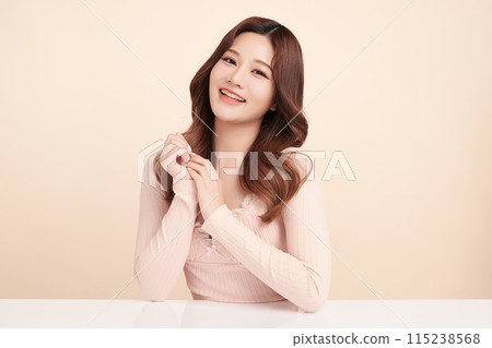 Beautiful young asian woman with clean fresh skin on beige background, Face care, Facial treatment, Cosmetology, beauty and spa, Asian women portrait. Beautiful young asian woman with clean fresh skin on beige background, Face care, Facial treatment, Cosmetology, beauty and spa, Asian women portrait. 115238568