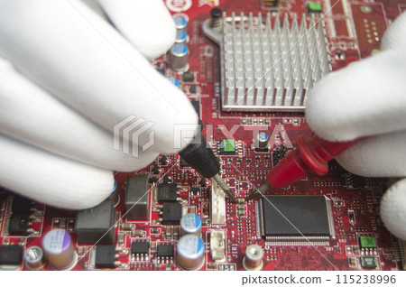 mechanic repairing motherboard, motherboard top view close-up, computer motherboard mechanic repairing motherboard, motherboard top view close-up, computer motherboard 115238996