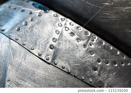 Shiny metal plates with rivets pattern, background photo 115239200