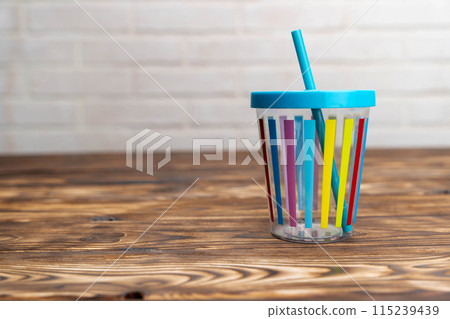 Cup With Straw on Table Cup With Straw on Table 115239439