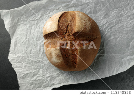 beautiful homemade raisin bread on parchment 115240538