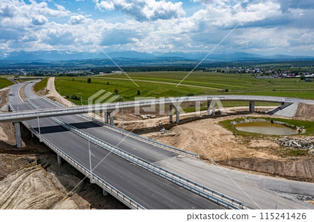 Drone shot of the highway construction from Krakow to Zakopane in the summer.  115241426
